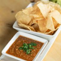 Chips and Roasted Salsa with Guacamole · Thinly sliced and crispy. Dip made from tomatos and onions. A creamy dip made from avocado.