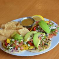 Veggie Tacos · Seasonal grilled vegetables and greens, pico de gallo, avocado, and queso fresco.