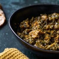 Gongura Goat · Goat (with bone) cooked with tangy gongura (Red Sorrell leaves), onions and exotic spices (a...