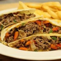Steak Quesadilla · Grilled steak with peppers, onions, and cheddar cheese served with sour cream and a side of ...