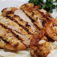 Chicken ＆ Shrimp Alfredo · Seasoned grilled chicken breast ＆ shrimp tossed in a creamy alfredo sauce served over fettuc...