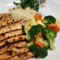 Grilled Chicken Breast Dinner · Served with rice pilaf and mixed vegetables.