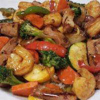 Chicken ＆ Shrimp Stir Fry · Chicken breast ＆ shrimp sauteed in a stir-fry sauce with peppers, onions, mixed vegetables, ...