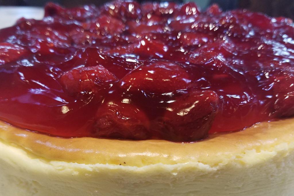 Strawberry Cheese Cake · Save room for a fresh piece of creamy cheesecake with a graham cracker crust and topped with strawberries.