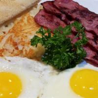 Breakfast Platter · Two eggs any style served with hashbrowns ＆ choice of bacon or sausage.