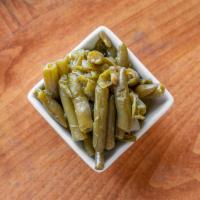 Green Beans · Slow cooked with smoked turkey meat bursting with savory goodness!