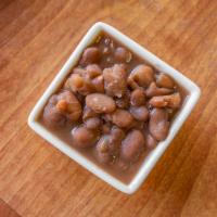 Pinto Beans · Slow simmered over low heat with smoked turkey meat to capture every seasoning.