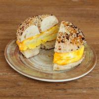 Egg and Cheese Bagel Sandwich · Two scrambled eggs with cheddar cheese on a toasted bagel. Add ham, turkey or bacon for an a...