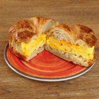 Egg and Cheese Croissant Sandwich · Two scrambled eggs with cheddar cheese on a butter croissant. Add ham, turkey or bacon for a...