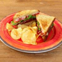 BLT · Bacon, mixed greens, sliced tomatoes and mayonnaise on toasted multi-grain bread.