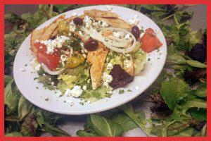 Greek Chicken Salad · Lemon chicken kabob, lettuce, cucumber, tomatoes, red onions, feta, kalamata olives, pita cr...