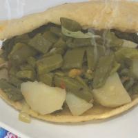 Nopales · Handmade gordita of corn or flour. With prickly pear, fresh pork cooked in red chili and ref...