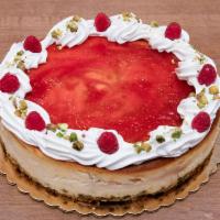 Rasberry Swirl Cheesecake with Pistachio crust · Classic cheesecake with a raspberry swirl, rich raspberry glaze, pistachio graham cracker cr...