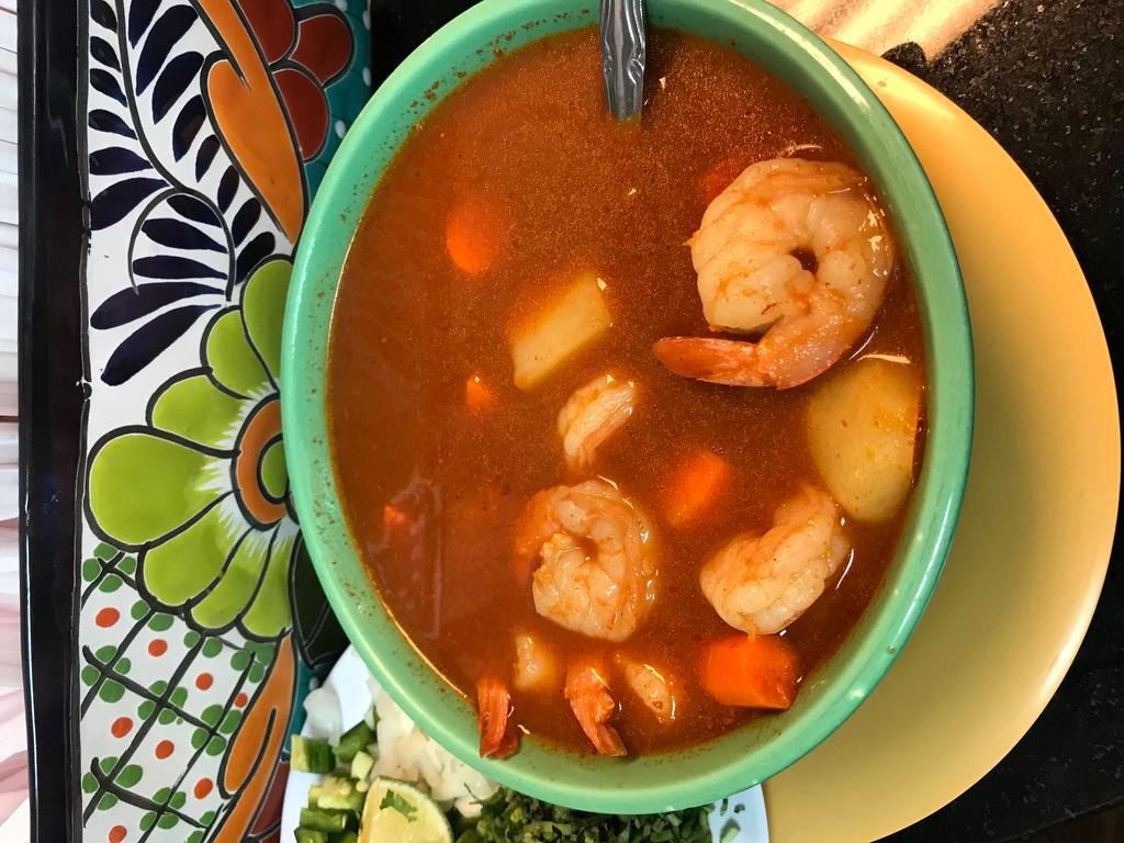 #55. Shrimp Soup / Caldo Camaron · Shrimp soup served with carrots, potatoes, chayote. With a side of onion, cilantro, chile and lime. Choice of tortillas.