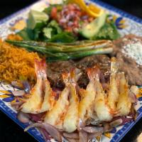 # 16. Mar y Tierra · Skirt steak, four jumbo seasoned marinated shrimp, grilled onion