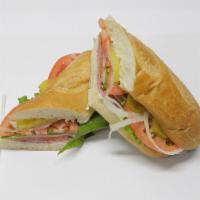 12. Italian Cold Sub Sandwich · Provolone cheese, salami, ham, pepperoni, tomatoes, mayonnaise, lettuce, red onion, oil & vi...
