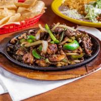 Fajitas La Fuente · Steak, chicken, chorizo, and shrimp grilled with bell peppers, tomatoes, and onions. Served ...