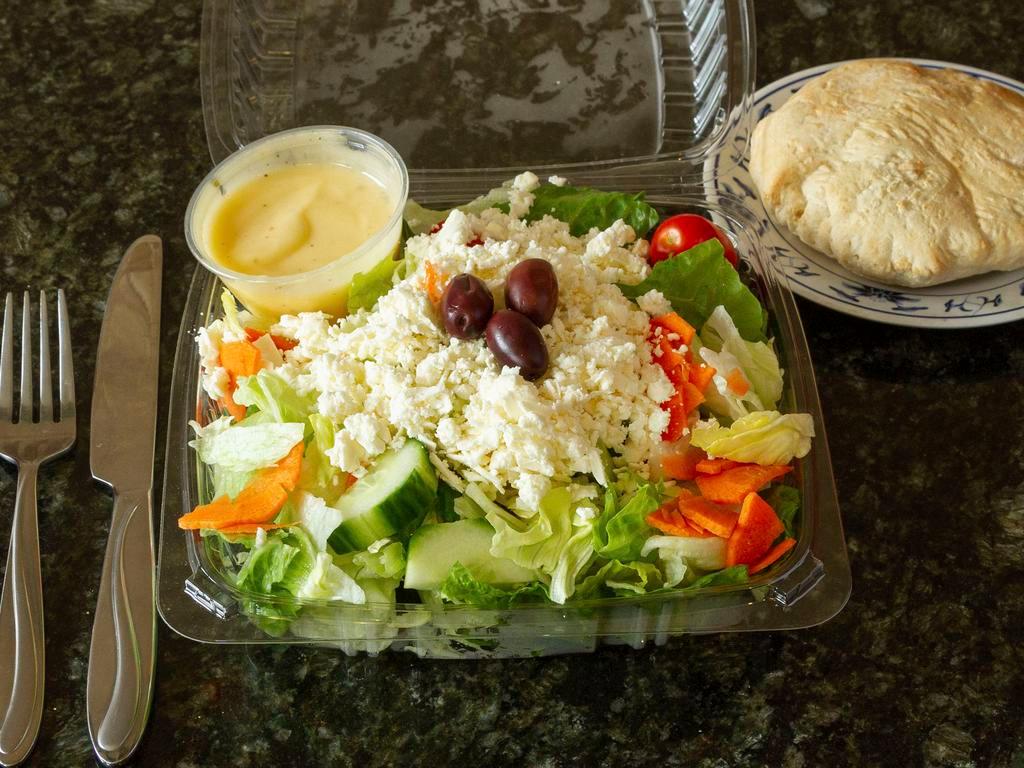 Greek Salad · Served with homemade pita bread.