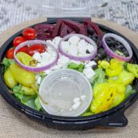 Greek Salad · Romaine lettuce mix, tomatoes, beets, onions, feta cheese, mild peppers and black olives.