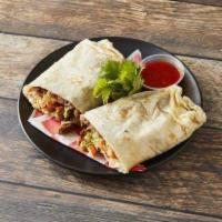 King Breakfast Burrito · A large flour tortilla filled with your Choice of Meat w/ scrambled eggs, beans, lettuce, to...