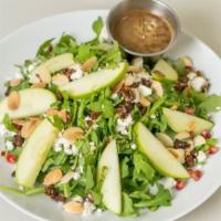 Fall Green Salad · arugula, apple, pomegranate, feta, sumac candied pecans, ja'ala seeds, mint, almonds, pomegr...