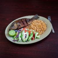 Mojarra · Fried tilapia served with rice and salad.