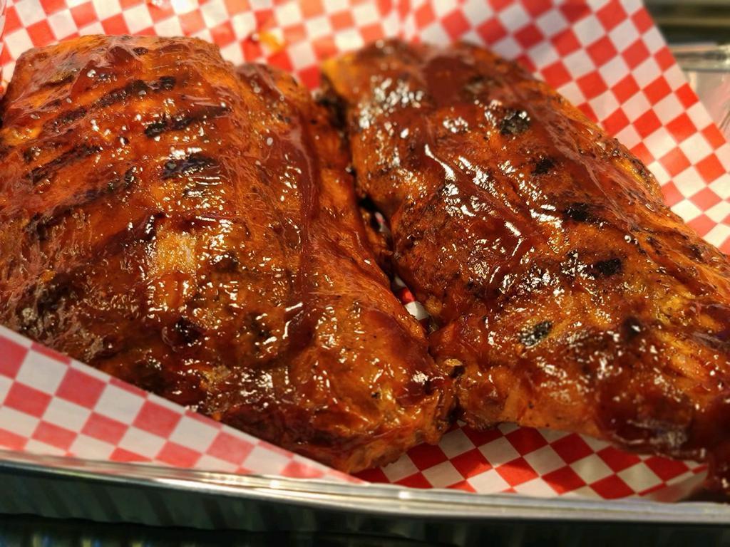 Baby Back Pork Ribs · White Marble Farms all natural, slow-cooked for 6 hours until tender and succulent