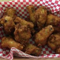 Wing Dings · Golden crispy breaded wings with sweet and sour sauce
