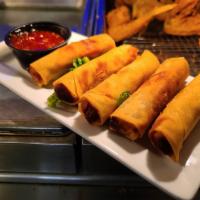 Philly Cheesesteak Rolls · Crispy rolls filled with steak and cheese, sweet chili dipping sauce