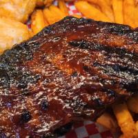 BBQ Rack of Ribs · DW's award winning St. Louis hickory house-smoked pork, 1/2 rack with granny smith coleslaw ...