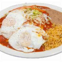 Enchiladas Rancheras · Cheese enchiladas topped with one egg any style. Traditional Mexican plate made with 3 corn ...