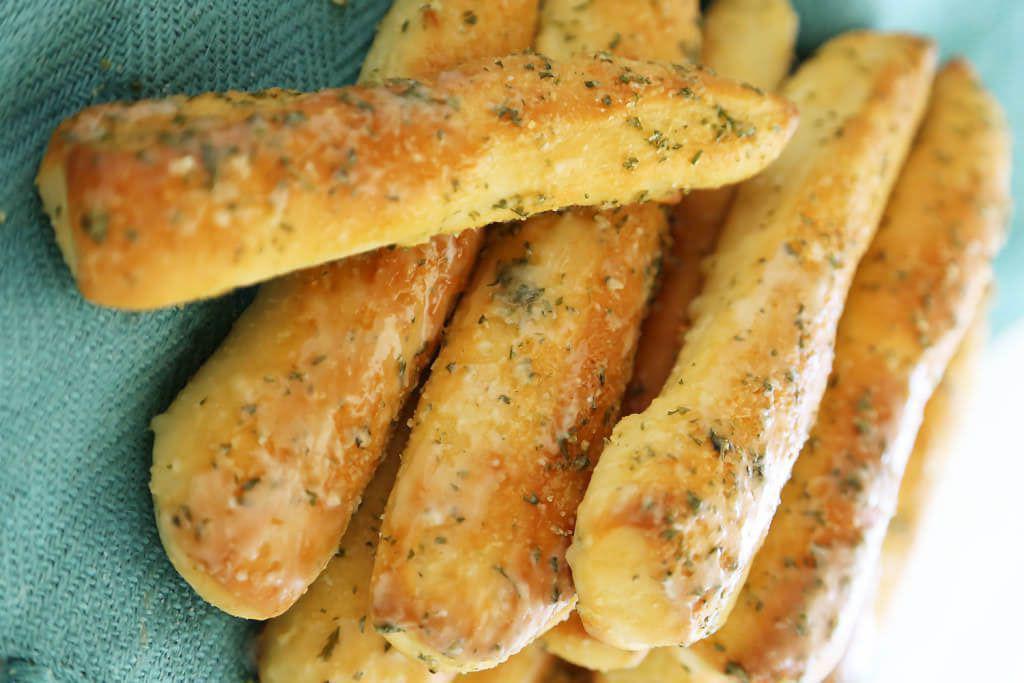 4 Garlic bread sticks · Topped with fresh garlic sauce and Parmesan cheese.