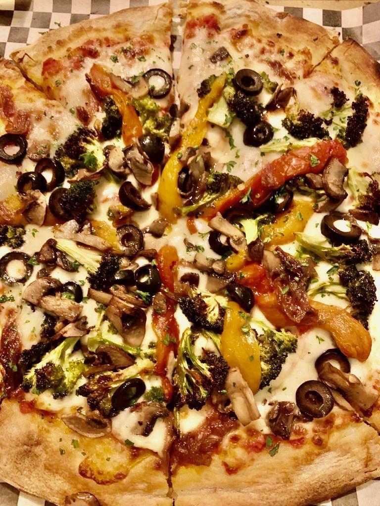 Fire Roasted Veggie Pizza · Peppers, red onions, sauteed mushrooms and black olives.