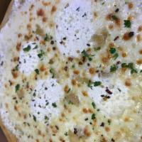 White Pizza · Ricotta, mozzarella, romano cheeses, fresh herbs and roasted garlic.