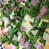 The Arugula, & Prosciutto Pizza · Baby arugula and prosciutto topped with fresh shaved Parmesan cheese.