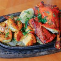 Amber Kitchen Mixed Grill ·  Cooked on charcoal fire in clay pot and served on sizzling platter.