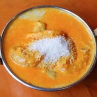 Prawns Goa Curry · King prawns cooked with coconut milk and spices.