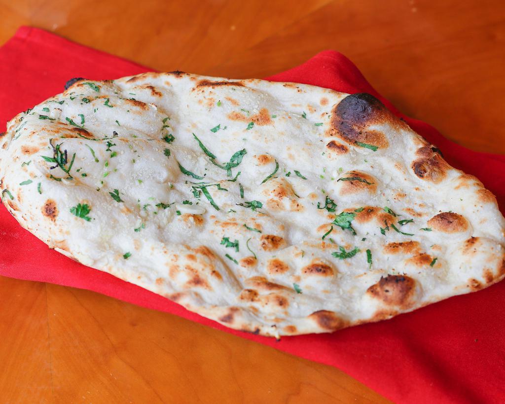 Garlic Naan · Leavened bread stuffed with fresh garlic.
