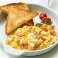 Desayuno Americano · Dos huevos a escoger, tostada o arepa, and jugo o cafe.

