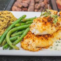 Baked Haddock · Freshly baked haddock filet with lemon, white wine and butter lightly coated with herb crack...