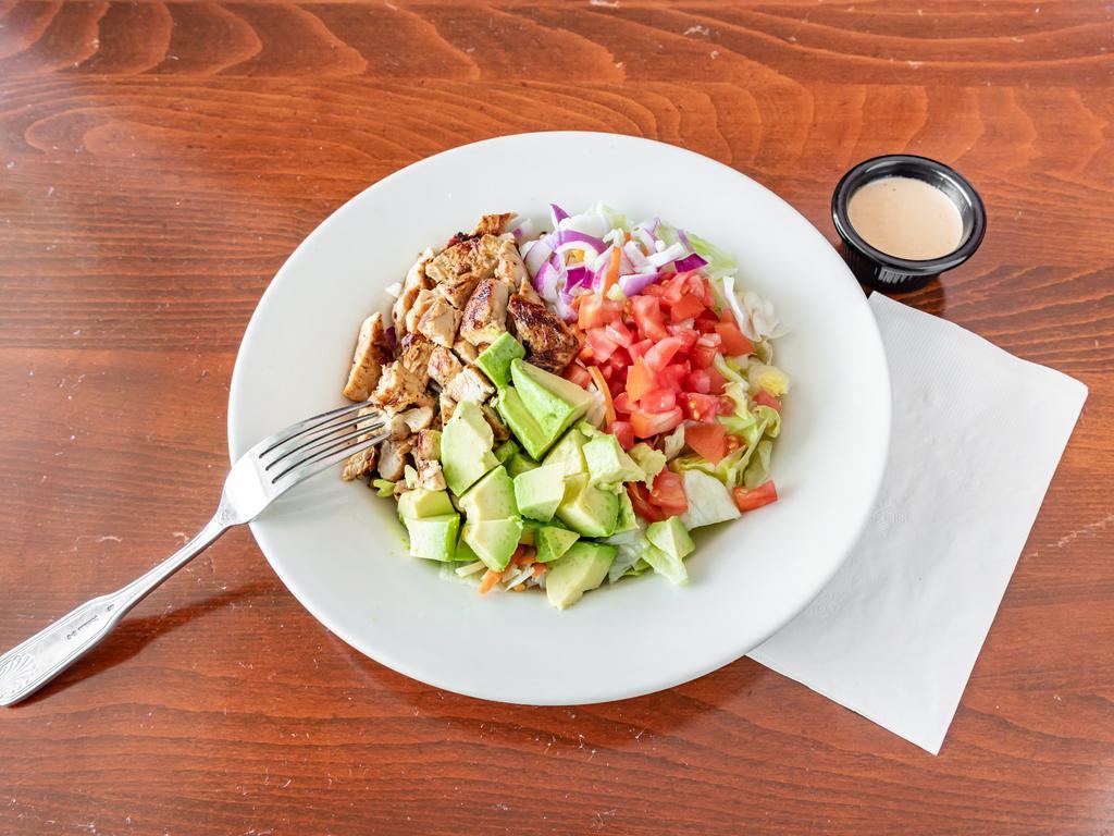 Grilled Chicken Salad · Lettuce slices, avocado, tomatoes, onions, shredded carrots, and cheese. Served with grilled chicken.
