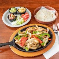 Sizzling Chicken Fajitas · Marinated chunks of a breast of chicken, onions, fresh bell peppers, tomatoes, green peppers...