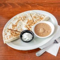 Grilled Chicken Quesadilla · Grilled chicken and cheese inside a large flour tortilla. Served with a side of refried bean...