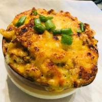 Mac N Cheese · Macaroni, cheese sauce, ham, bacon, jalapenos, cheddar, and Swiss cheese, and scallions.