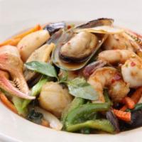 Spicy Seafood Combination · Sauteed shrimp, mussels, calamari, crab claw and scallop with bell peppers and basil in Thai...