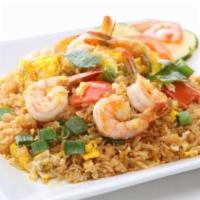 Spicy Seafood Fried Rice · Fried rice with shrimp, mussels, calamari, crab claw, scallop, onion, and sweet basil.