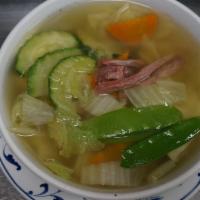 37.  Wonton Soup · Homemade wontons, char siu, and assorted vegetables cooked in chicken broth.