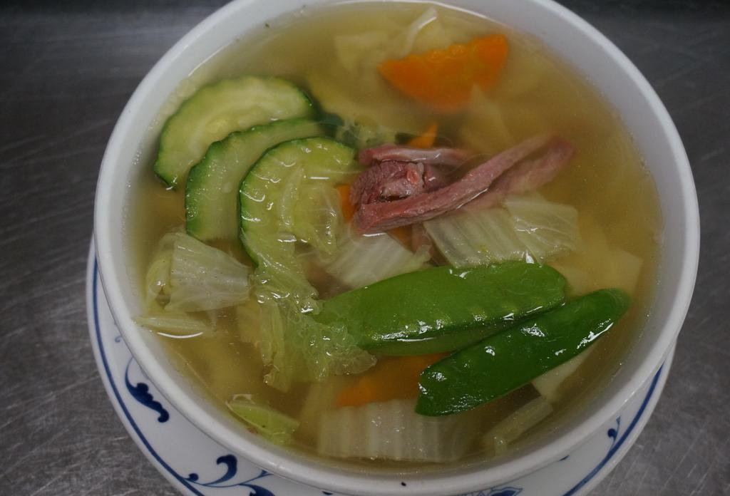 37.  Wonton Soup · Homemade wontons, char siu, and assorted vegetables cooked in chicken broth.
