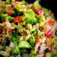 92. Vegetable Fried Rice · Stir fried broccoli, cabbage, peas, carrots and egg fried rice.