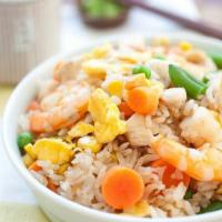 97. Combo Fried Rice · Beef, white meat chicken, Char Siu, shrimp, peas, carrots and egg fried rice.
